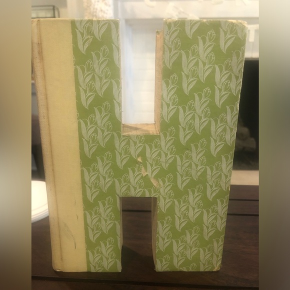 Anthropologie: Hand cut letters from Reader’s Digest books. Spells out “HOME.” - Picture 6 of 15